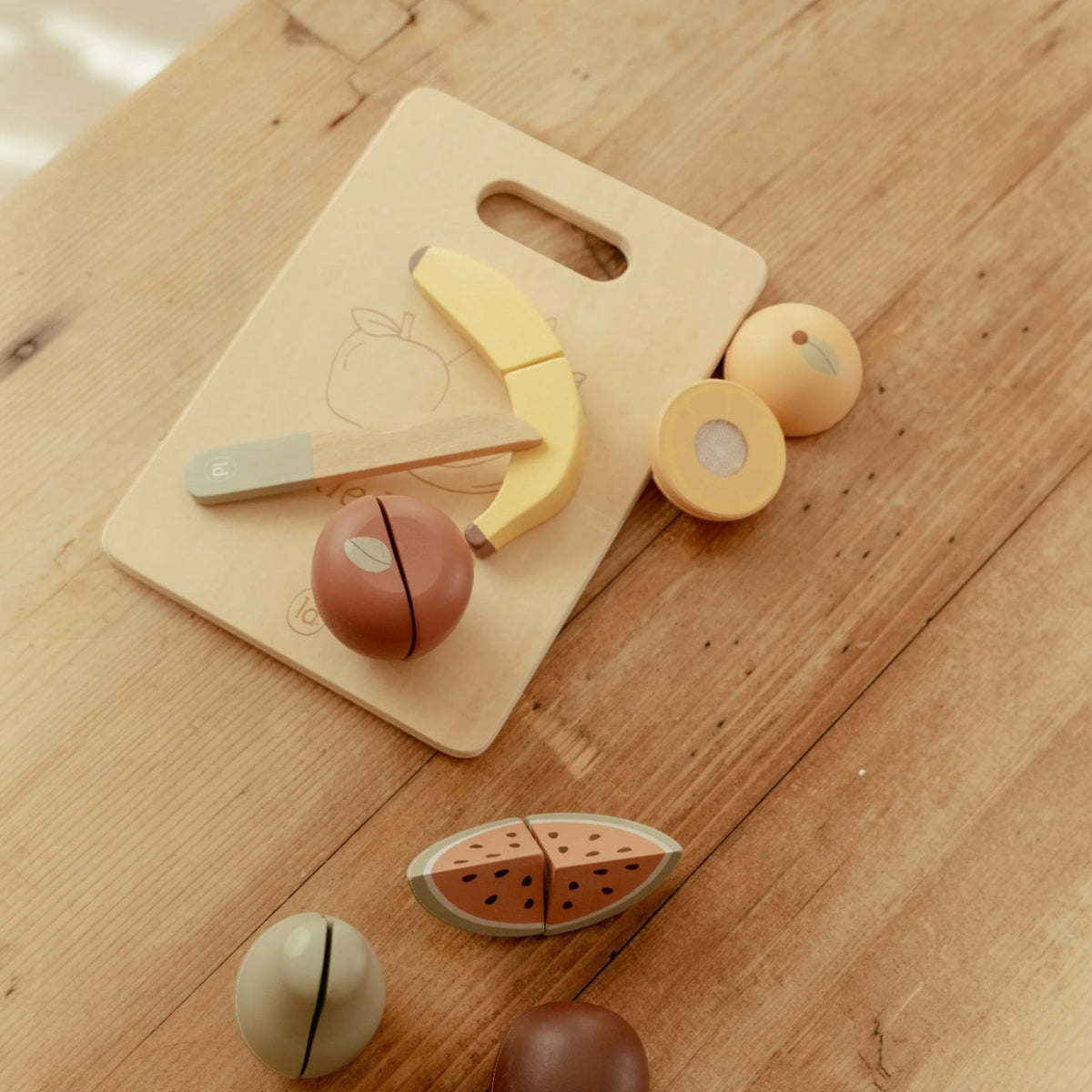 Wooden cutting fruits with board