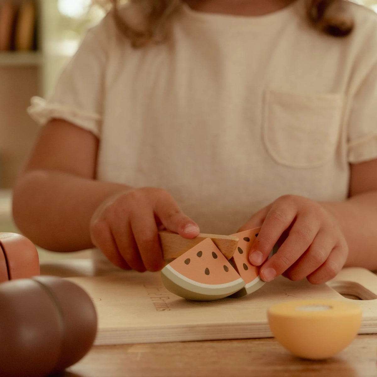Wooden cutting fruits with board