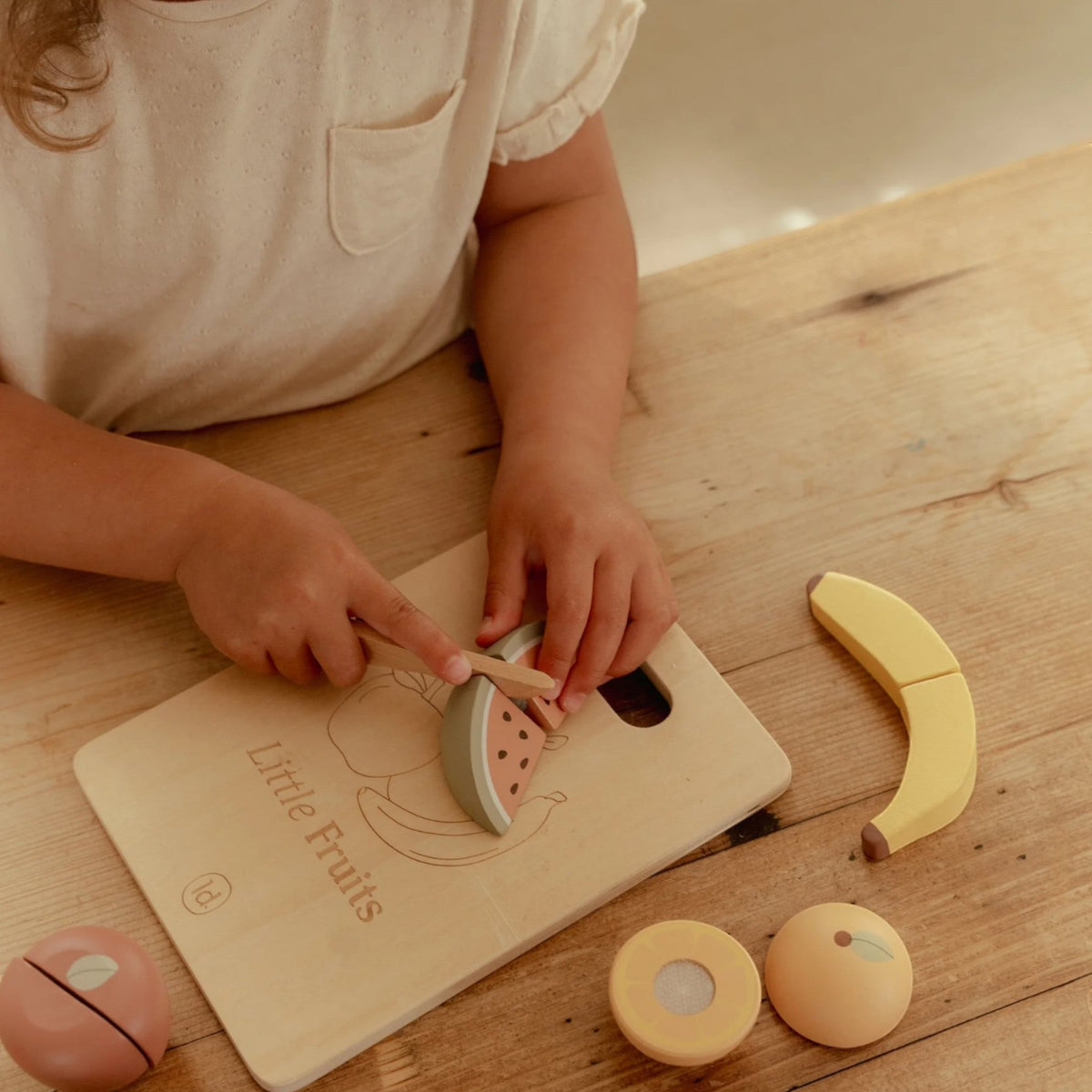 Wooden cutting fruits with board