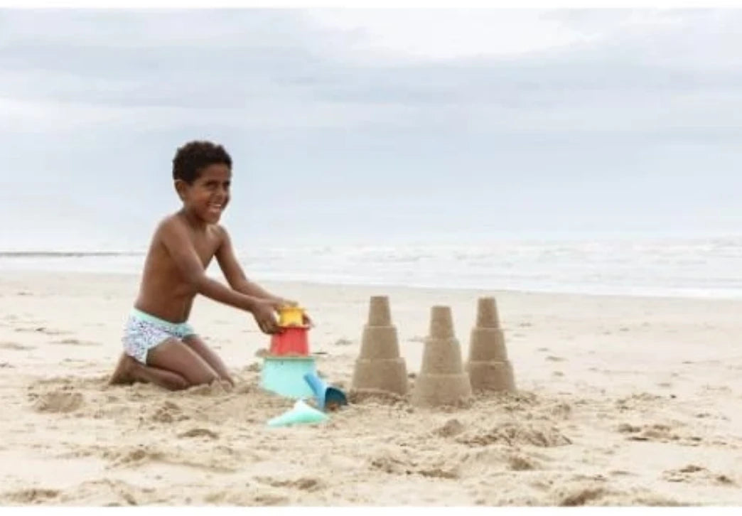 Toy set in a beach bag with pyramid and rake-shovel