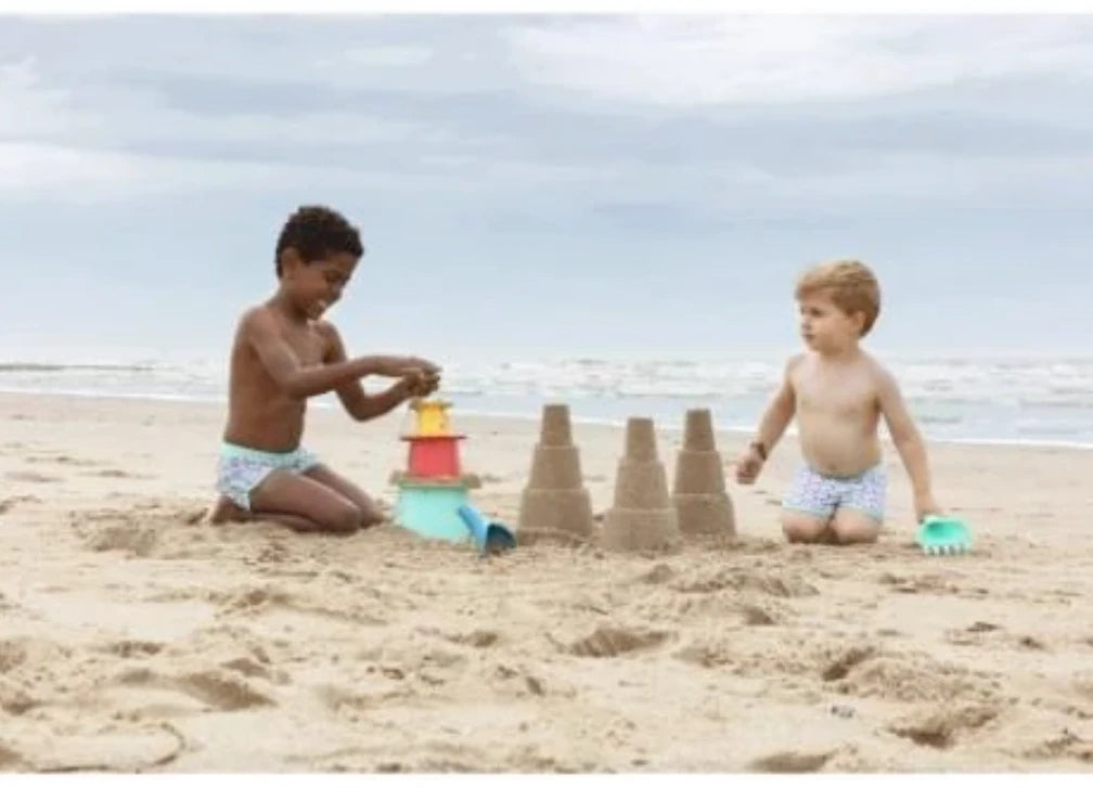 Toy set in a beach bag with pyramid and rake-shovel